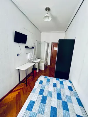 Cama o camas de una habitación en Hostal Conde De Alba
