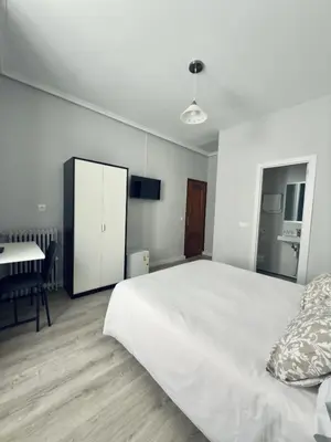 Cama o camas de una habitación en Hostal Conde De Alba