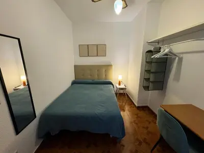 Cama o camas de una habitación en Habitaciones Figueroa