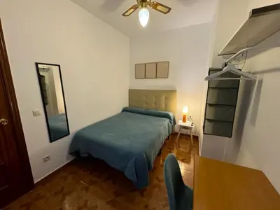 Cama o camas de una habitación en Habitaciones Figueroa