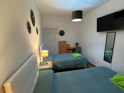 Cama o camas de una habitación en Habitaciones Figueroa