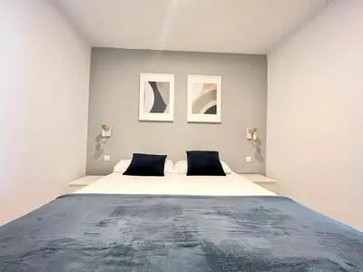 Cama o camas de una habitación en HUERTAS FLAT