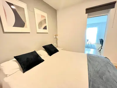 Cama o camas de una habitación en HUERTAS FLAT