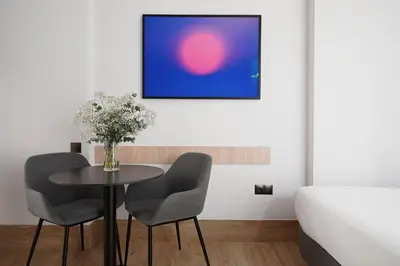 Cama o camas de una habitación en Numa Madrid Goya