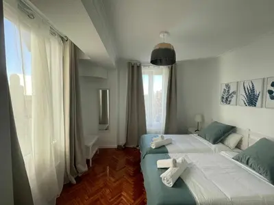 Cama o camas de una habitación en Apartamento con terraza y vistas Alcalá-Retiro
