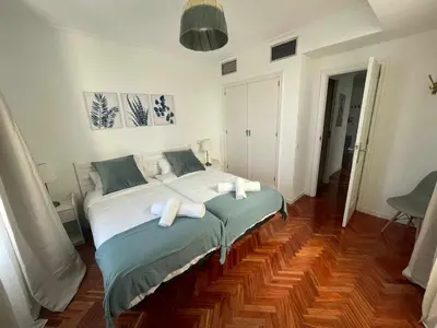 Cama o camas de una habitación en Apartamento con terraza y vistas Alcalá-Retiro