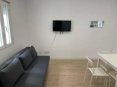 Una televisión o centro de entretenimiento en U4 Apartamento centro Madrid