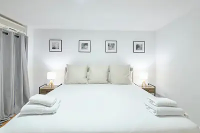 Cama o camas de una habitación en Lovely Apartments - Alójate en el corazón de Madrid