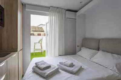 Cama o camas de una habitación en Heima Penthouse suite Old Town