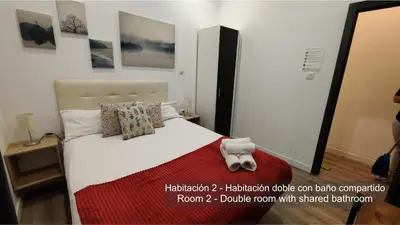 Cama o camas de una habitación en Chueca Rooms Madrid