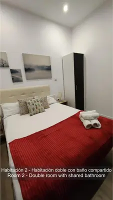 Cama o camas de una habitación en Chueca Rooms Madrid