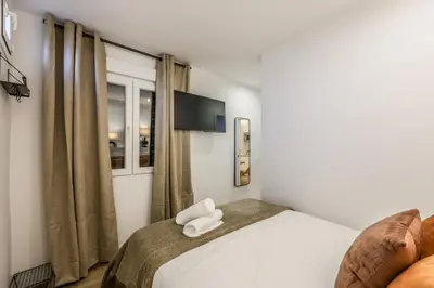 Cama o camas de una habitación en Apartamento doble centro Madrid