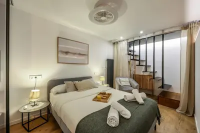 Cama o camas de una habitación en Design and elegance in the heart of Madrid