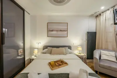 Cama o camas de una habitación en Design and elegance in the heart of Madrid