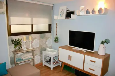 Una televisión o centro de entretenimiento en Nice duplex in Barbieri-B