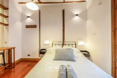 Cama o camas de una habitación en MyHouseSpain - Moderno Estudio en Plaza España