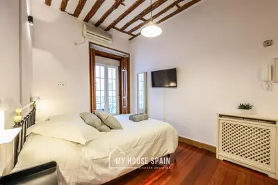 Cama o camas de una habitación en MyHouseSpain - Moderno Estudio en Plaza España