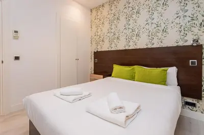 Cama o camas de una habitación en GuestReady- Modern Aparthotel in Salamanca -Madrid