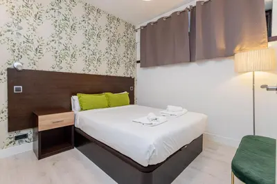 Cama o camas de una habitación en GuestReady- Modern Aparthotel in Salamanca -Madrid