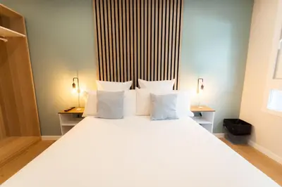 Cama o camas de una habitación en I'M Room Suites Nuevos Ministerios - Bernabeu 'Digital Access'