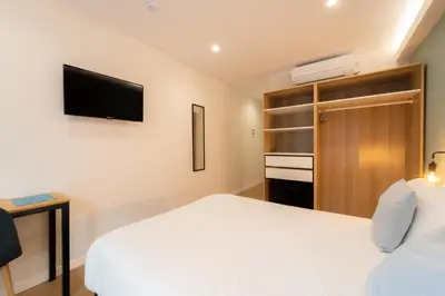 Cama o camas de una habitación en I'M Room Suites Nuevos Ministerios - Bernabeu 'Digital Access'