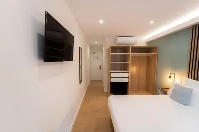 Cama o camas de una habitación en I'M Room Suites Nuevos Ministerios - Bernabeu 'Digital Access'