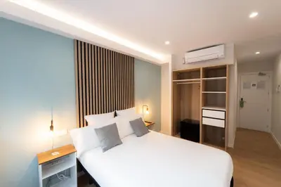 Cama o camas de una habitación en I'M Room Suites Nuevos Ministerios - Bernabeu 'Digital Access'