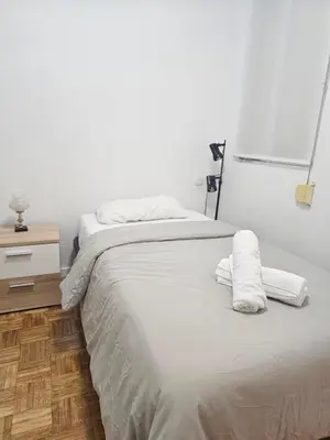 Cama o camas de una habitación en MAD COCO Apartamento Temporada Frente al Prado