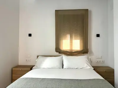 Cama o camas de una habitación en CavaBajaSuites