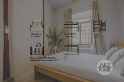 Cama o camas de una habitación en Centrico Apt 7pax en Anton Martin-Centro E2