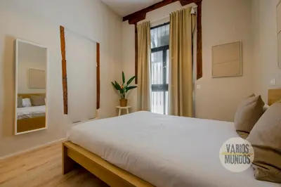 Cama o camas de una habitación en Centrico Apt 7pax en Anton Martin-Centro E2