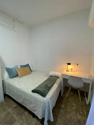 Cama o camas de una habitación en Apartamentos EconoStay Fuencarral