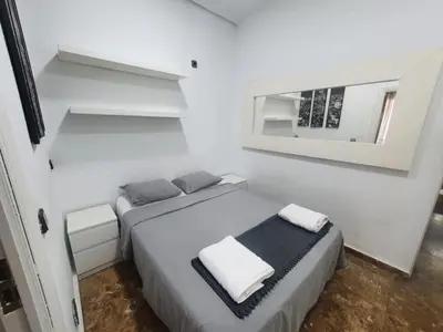 Cama o camas de una habitación en Apartamentos EconoStay Fuencarral