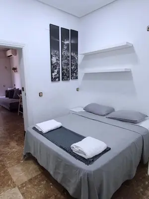Cama o camas de una habitación en Apartamentos EconoStay Fuencarral