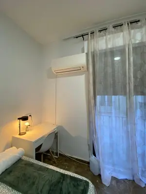 Cama o camas de una habitación en Apartamentos EconoStay Fuencarral