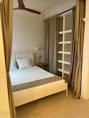 Cama o camas de una habitación en Exyca Malasaña