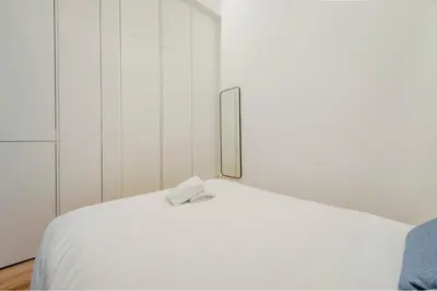 Cama o camas de una habitación en Escapada hogareña para 3 en Calle de Fomento