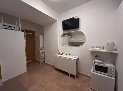 Una cocina o zona de cocina en Cute studio in Gran Via -Si1