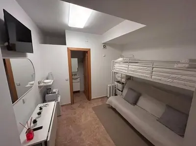 Cama o camas de una habitación en Cute studio in Gran Via -Si1