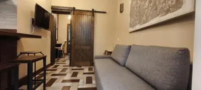 Una televisión o centro de entretenimiento en Cozy apartment in Chueca. Barb1
