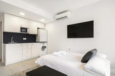Cama o camas de una habitación en apartamentos reformados en madrid rio con parking