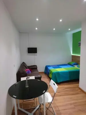 Cama o camas de una habitación en Apartamentos EconoStay Chueca