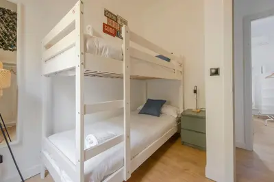 Cama o camas de una habitación en Aventura y tradición en La Latina, conoce Toledo 77