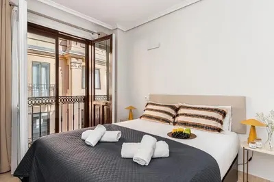 Cama o camas de una habitación en Waou Gran Via Studio IV - Corta Duración