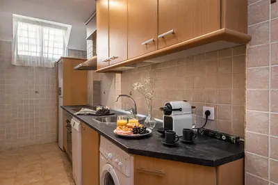 Una cocina o zona de cocina en Waou Gran Via Attic - Corta Duración