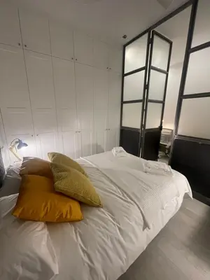 Cama o camas de una habitación en CASA DE HUÉSPEDES ALMIRANTE MADRID