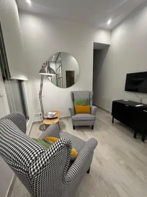 Zona de estar de CASA DE HUÉSPEDES ALMIRANTE MADRID