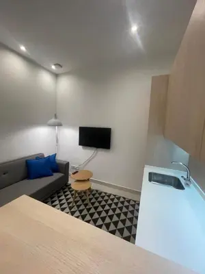 Una televisión o centro de entretenimiento en CASA DE HUÉSPEDES ALMIRANTE MADRID