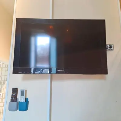 Una televisión o centro de entretenimiento en LOFT DELUXE - MADRID RETIRO