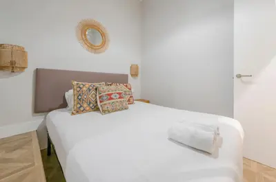 Cama o camas de una habitación en Escapada urbana para 8 en Calle del Infante GL